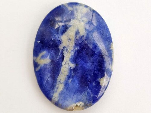 Highly polished Sodalite thumb stone 40 x 30 mm. The thumb stones have been designed to have a pleasing feel with the highest quality finish. They are shaped to fit beautifully between the thumb and fingers. Being a natural product these stones may have natural blemishes and vary in colour and banding. www.naturalhealingshop.co.uk based in Nuneaton for crystals, spiritual healing, meditation, relaxation, spiritual development,workshops.